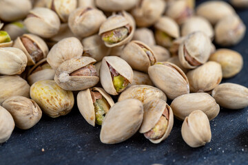 a large number of salty and crispy pistachios close-up