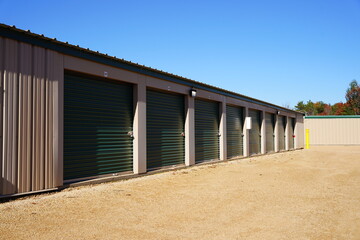 Green and tan storage units service the community to hold owners 