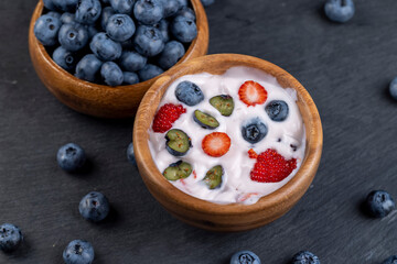 ripe blueberry berries and yogurt with blueberry and blueberry flavor
