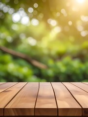 Wooden table top on blur background of green garden with bokeh sunlight.
