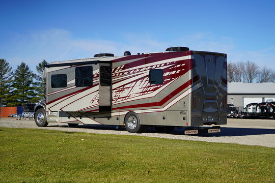 Renegade Valencia 38RB super c RV sitting outside to be sold.