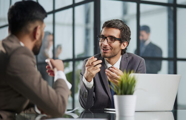 professional businesspeople working together on research plan in boardroom.