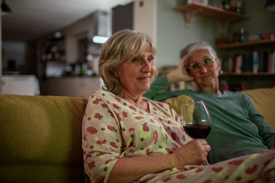 Senior Couple Enjoying Wine and Company at Home
