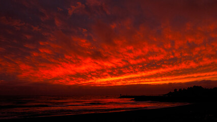 Fototapeta na wymiar Red Sunset Over Ocean - 2932