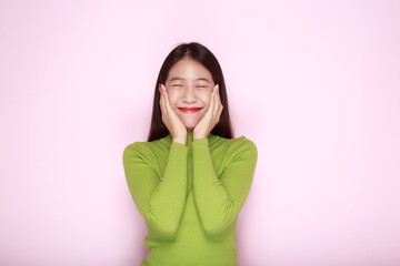 Beautiful girl smiling happily, Portrait of a beautiful young woman in a light pink background, happy and smile, posting in stand position.