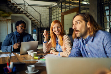 Young entrepreneurs collaborating on new project in modern office