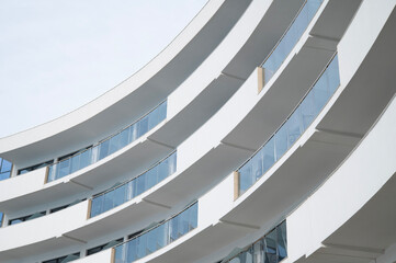 Geometry and perspective in architecture. Facade of a building with balconies and windows.
