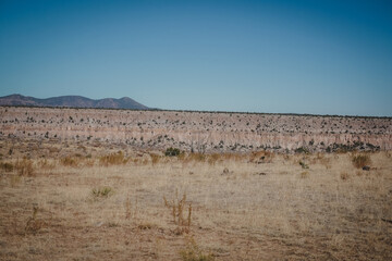 Pink rocky cliffs in desert landscape near Los Alamos New Mexico