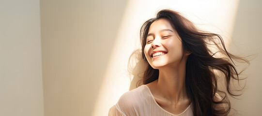 Portrait of beautiful smiling asian woman with long hair and closed eyes - obrazy, fototapety, plakaty