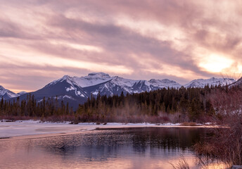 Sun setting over the mountains. Vermillion Lakes, Banff National Park, Alberta, Canada