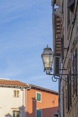 Picture of a historic street lamp on a house wall