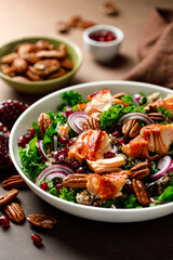 Salmon superfood salad with grilled fish, kale, quinoa, pecan nuts, red onion and pomegranate - obrazy, fototapety, plakaty