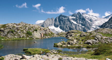 Fototapeta na wymiar Beautiful mountain landscape with a glacial lake. Lake Mandrone, Italy. Panoramic image