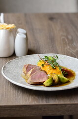 roasted pork loin with brussels sprouts and sauce, serving food