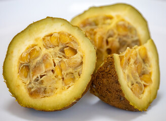 Ripe genipap (Genipa americana) fruit in selective focus and fine details