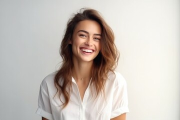Happy woman with long hair smiling, isolated light background