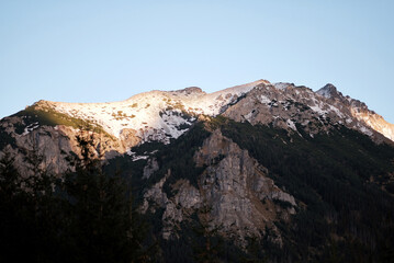 Rocky Mountain range peaks during the golden hour in autumn