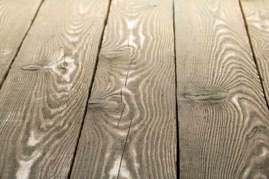 Natural background made of wooden planks with contrasting lines close-up