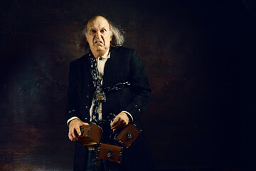 Ghost of Jacob Marley, Scrooge ex-business partner, chained with a padlock, carrying treasure chests and keys