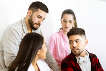 Youth hipster group chatting at workplace.