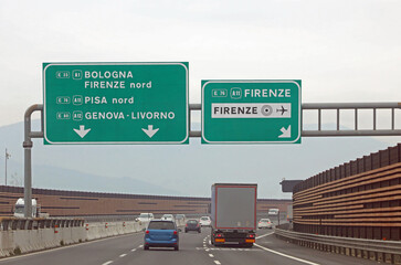 road sign with the crossroads to reach the Italian towns Bologna Florence and Genoa