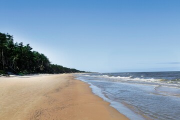 The coast of the Baltic Sea near Leba destination and Slovenian National Park with the largest sand dunes in Europe.