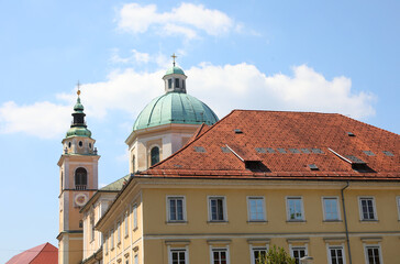 Fototapeta na wymiar city of Ljubljana with the palace and behind the church of St. Nicholas with bell tower and dome