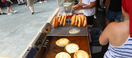 Many Pancakes Fried in Hot Oil at a Street Food Stall
