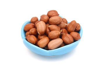 Dried peanuts in closeup on white