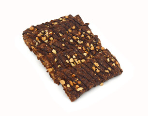 Honey bars with peanuts on white background