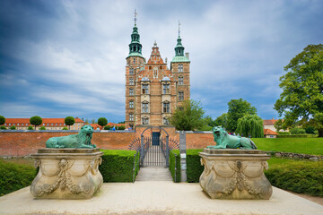 Lions at the Gate of Rosenborg Castle, Copenhagen, Denmark. Unrecognizable people.