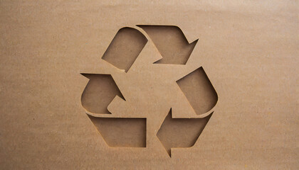 recycle sign on brown cardboard paper texture background