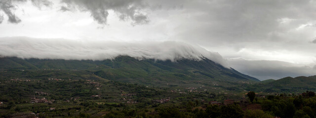 Clouds descended and herded amazingly alongside the mountaintop like a white covering, Benevento, Italy.