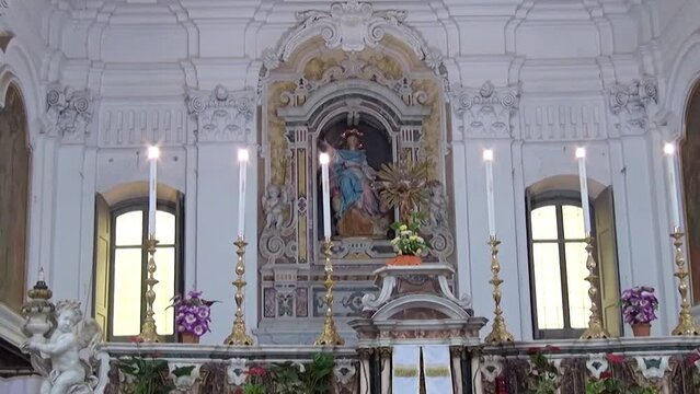 Marble aedicule with Madonna statue and altar in the Church of Saint Maria degli Angeli, Visciano, Naples, Italy