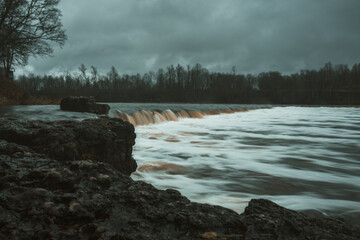 Time turns to liquid as the small waterfall whispers its story in the gentle dance of long exposure.