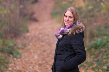 Beautiful girl in the woods near the trees