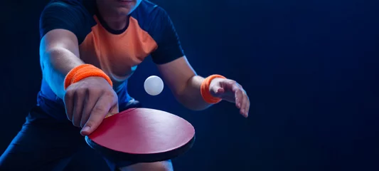 Table tennis player in action close-up photo. Ping pong horizontal banner. Download a photo of a table tennis player for a tenis racket packaging design. Image for tennis ball box template. © Mike Orlov