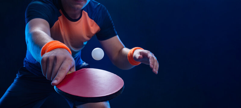 Table tennis player in action close-up photo. Ping pong horizontal banner. Download a photo of a table tennis player for a tenis racket packaging design. Image for tennis ball box template.