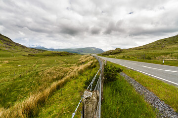 Upland road through moorland in Eryri or Snowdonia national Park, Wales. - 679860022