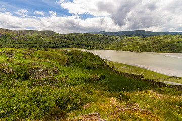 Banks of river in North Wales with tidal edge and pond wide angle, looking south east. - 679860442