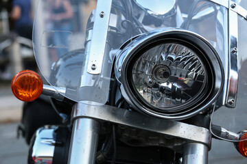 Vintage motorbike, focus on a headlamp. Retro motorcycle with headlight.