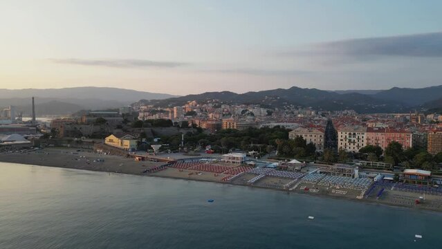 City on the sea coast at sunset, view from a drone.