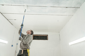 Bright Elegance: Expansive Room Transformed with Precision into a Crisp, White Oasis of Light.