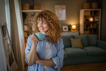 Adult caucasian woman self portrait hold cup of coffee or tea smile