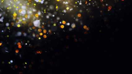 Background of golden defocused lights with copy space. Golden confetti defocused over the darkness