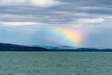 Obraz premium Rainbow refraction over Lake Balaton in autumn