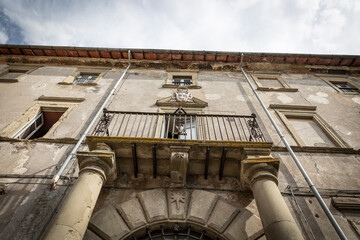 facade with a balcony of an old building in Sutri, province of Viterbo, Lazio, Italy - obrazy, fototapety, plakaty