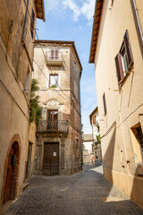 a street with typical houses in Sutri Ancient town, province of Viterbo, Lazio, Italy