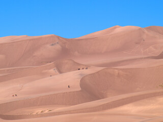 Hikers in Great Sand Dunes National Park, Colorado. 