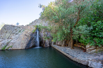 Lake and waterfall on the river beach of Pego set amongst the mountains of the Portuguese village of Penha Garcia, PR3 circuit